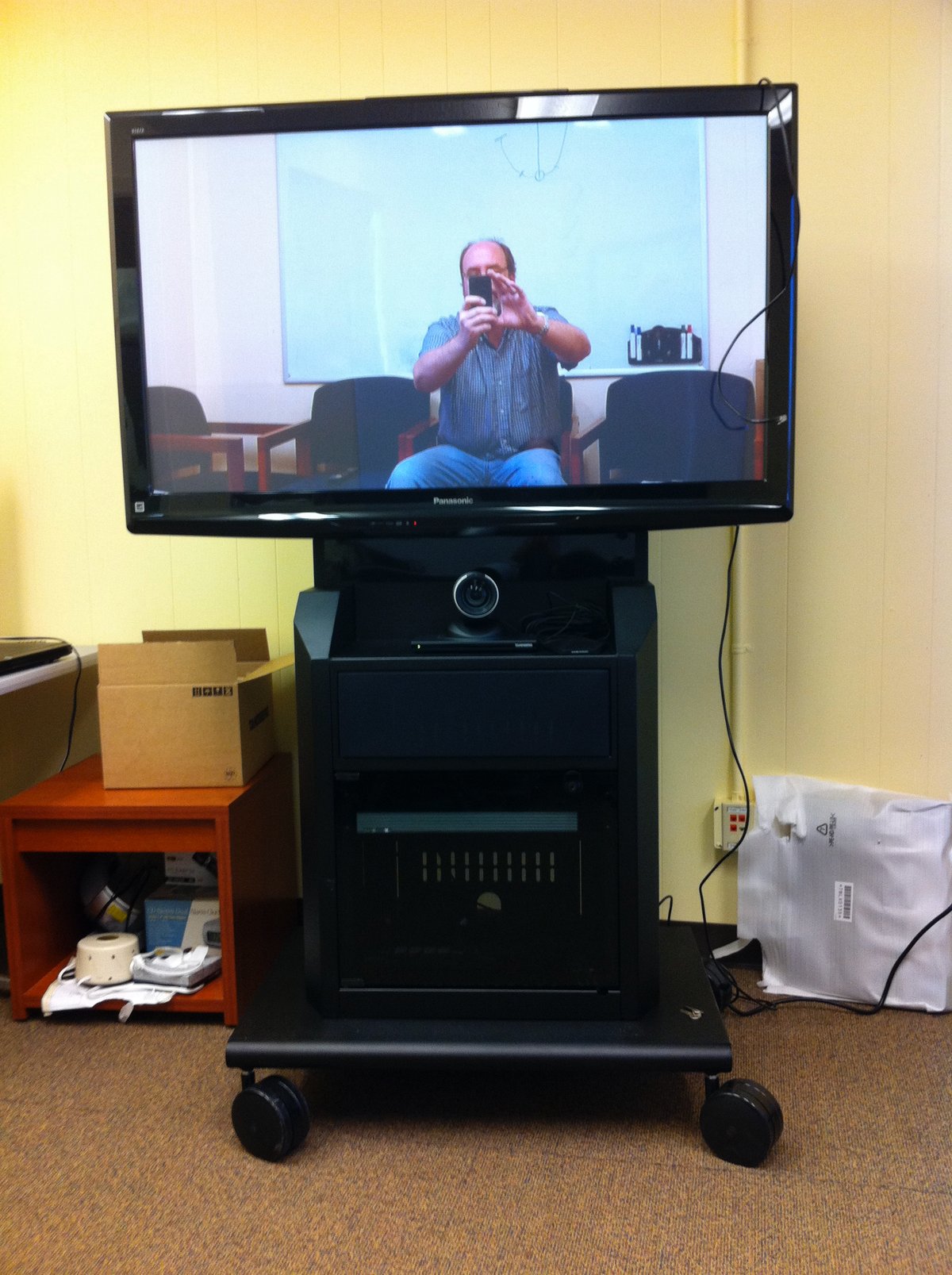A photo of a technician taking a photo of a vtc system